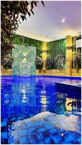 a swimming pool with blue water in a house at Villa Almedina Spa in Vlasic