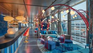 a view of a bar with chairs and tables at W Sydney in Sydney