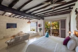 TV a/nebo společenská místnost v ubytování Las Nubes de Holbox