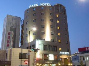 a building with a sign on top of it at Kuwana Park Hotel - Vacation STAY 66818v in Kuwana +17 photos
