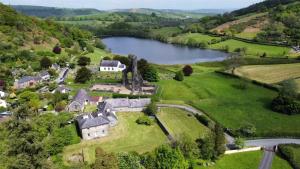 an aerial view of a large estate with a lake at Red Kite Lodge in Llandeilo