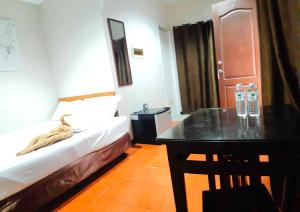 Letto o letti in una camera di Hotel California Suite