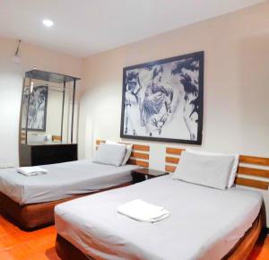 Letto o letti in una camera di Hotel California Suite