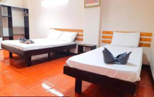 Letto o letti in una camera di Hotel California Suite