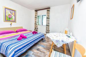 Postel nebo postele na pokoji v ubytování Apartment Goran