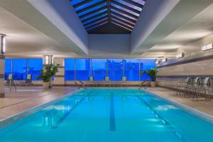 a swimming pool with a view of a building at The Westin Jersey City Newport in Jersey City