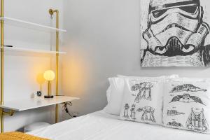 a bedroom with a bed with a painting on the wall at Luke's Jedi Meditation Chamber in Seattle