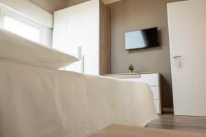 Postel nebo postele na pokoji v ubytování Affittacamere Bar Leo