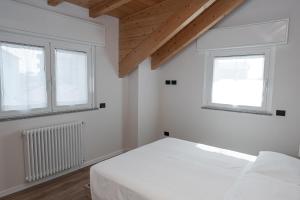 Postel nebo postele na pokoji v ubytování Affittacamere Bar Leo