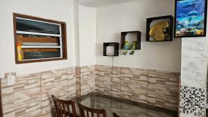 a bathroom with a shower with a glass door at Casa Will Maresias in Maresias +13 photos