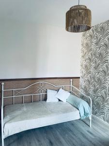 Postel nebo postele na pokoji v ubytování Appartement centre de Charlieu