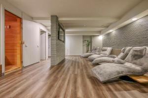 a row of couches in a room with wooden floors at Radisson Hotel Kaunas in Kaunas