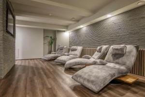 a waiting room with four chairs in a row at Radisson Hotel Kaunas in Kaunas