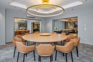 a dining room with a table and chairs at Radisson Hotel Kaunas in Kaunas