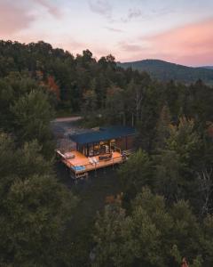 an aerial view of a house in the woods at Andas cabin CITQ#313550 in Lac-Superieur