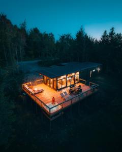 an overhead view of a house with a deck at night at Andas cabin CITQ#313550 in Lac-Superieur