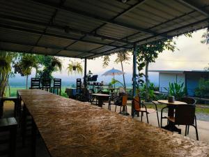 Restoranas ar kita vieta pavalgyti apgyvendinimo įstaigoje นะลาวิว รีสอร์ท ปัว Nala View Resort Pua