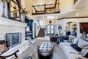a living room with a couch and a fireplace at Lubbock Luxury Living in Lubbock