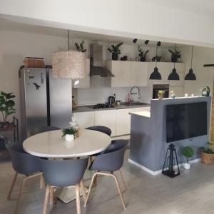 a kitchen and dining room with a table and chairs at Holiday house with a parking space Drage, Biograd - 21287 in Pakoštane