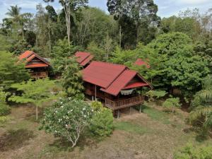 an aerial view of a house with a red roof at Sabai House Bungalow in Ko Yao Noi