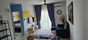 a living room with a chair and a window at 2 Bedroom with Balcony Nearest KLIA in Sepang