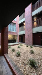 an external view of a brick building with a courtyard at Stylish Apartment City Centre in Sheffield