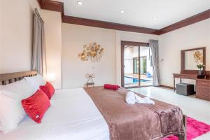 Ένα ή περισσότερα κρεβάτια σε δωμάτιο στο Asia Paradise Pool Villa, Jomtien Beach, Pattaya
