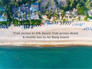 an aerial view of a beach with the words free access to six six beach club at Wyndham Garden Hoi An Cua Dai Beach in Hoi An