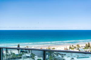 a view of the beach and the ocean from a balcony at H-Residences - GCLR in Gold Coast