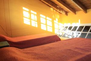 Postel nebo postele na pokoji v ubytování Posada Newen + 6 fotografií