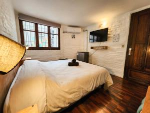 Postel nebo postele na pokoji v ubytování MedioMundo Hostel