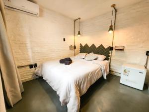 Postel nebo postele na pokoji v ubytování MedioMundo Hostel