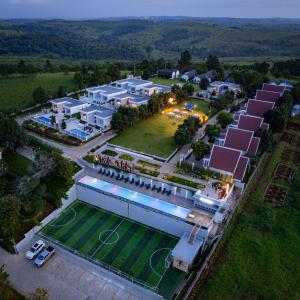 an aerial view of a building with a tennis court at Pidoma Resort in Senmonorom