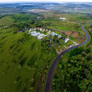 an aerial view of a house on a hill with a road at Pidoma Resort in Sen Monorom