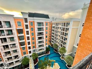 an aerial view of an apartment complex with a river at Espana Condo Jomtien By AEY in Jomtien Beach