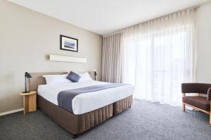 Postel nebo postele na pokoji v ubytování Abode Gungahlin