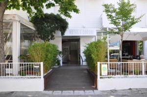 a walkway leading to the front of a building at Hotel Consul - Family Hotel in Riccione