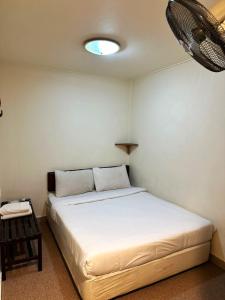 Postel nebo postele na pokoji v ubytování Hotel BB Inn @ Cameron