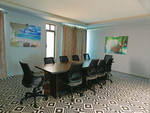 a conference room with a table and chairs at The Grand Anukampa hotel Jaipur in Jaipur