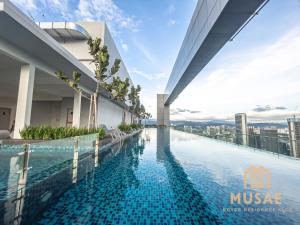 a swimming pool on the roof of a building at Royce Residence KLCC by MUSAE Kuala Lumpur in Kuala Lumpur
