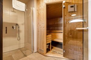 a bathroom with a shower and a glass door at Luxury Pool Villa Gradin - Happy Rentals in Gračišče