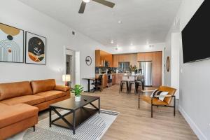 a living room with a couch and a table at Stunning Corporate Housing Near Hill AFB and DCC in Clearfield