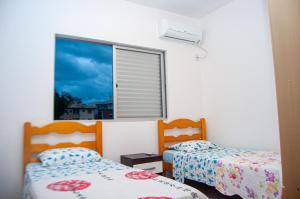 Postel nebo postele na pokoji v ubytování Pousada Emanuelli