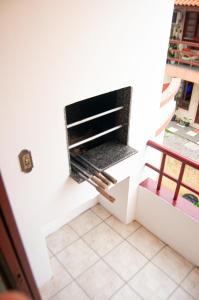 TV a/nebo společenská místnost v ubytování Pousada Emanuelli