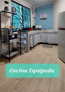 a kitchen with a sink and a counter top at Villa Chungos in Quebrada Ganado
