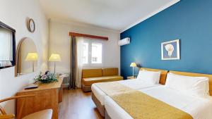 Postel nebo postele na pokoji v ubytování Lucy Hotel