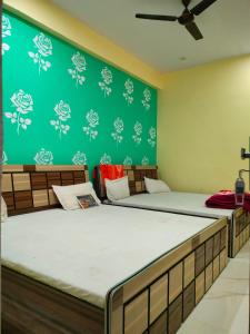 Postelja oz. postelje v sobi nastanitve Hotel Shiv Shakti