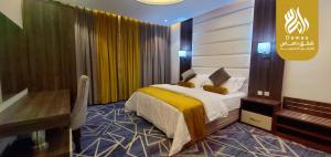 Postel nebo postele na pokoji v ubytování شقق داماس للشقق المخدومة Damas Serviced Apartments