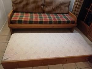 Łóżko lub łóżka w pokoju w obiekcie Appartement les chalets d estives