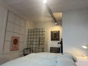 Postel nebo postele na pokoji v ubytování Loft by Conceptliving